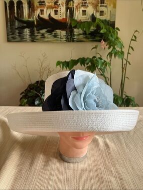 Elegant White Satin Ribbon Hat with Navy Blue and Dusty Blue Floral Accent